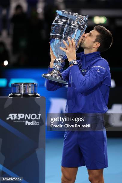 Novak Djokovic of Serbia poses with the world number 1 trophy for his 7th consecutive year during Day Two of the Nitto ATP World Tour Finals at Pala...