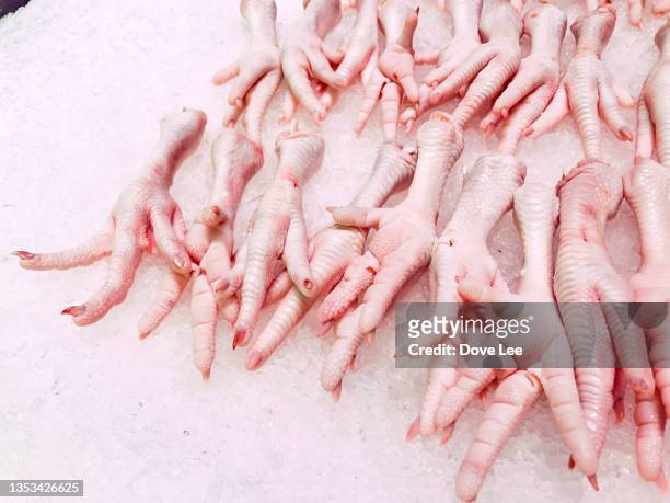 raw chicken feets in the supermarket - animal foot stock pictures, royalty-free photos & images