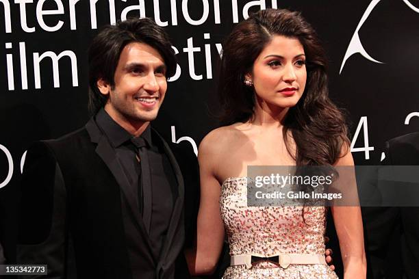 Bollywood actors Ranveer Singhand and Anushka Sharma pose on the red carpet during the 2011 Dubai International Film Festival on December 8, 2011 in...