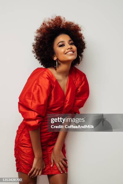 beautiful smiling girl with curly hairstyle - fashion dress stock pictures, royalty-free photos & images