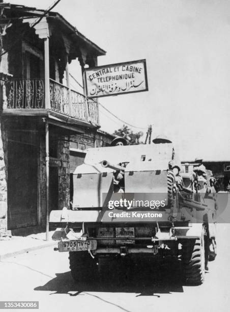 British 6th Infantry Division, 2pdr Portee anti tank gun mounted on a Morris CS8 15 Cwt vehicle on the road to Damascus in pursuit of the Vichy...