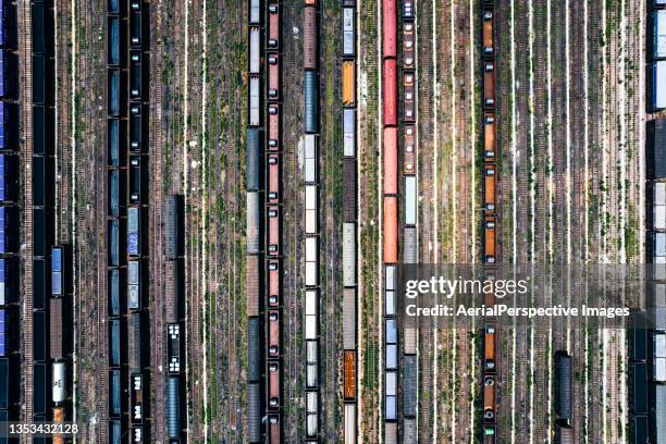 freight trains and railroad station - weichen gleise stock-fotos und bilder