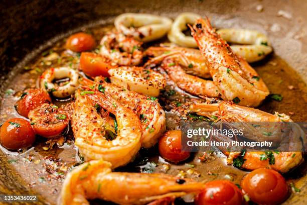 making gambas aglio on pan shrimps - grilled stock pictures, royalty-free photos & images