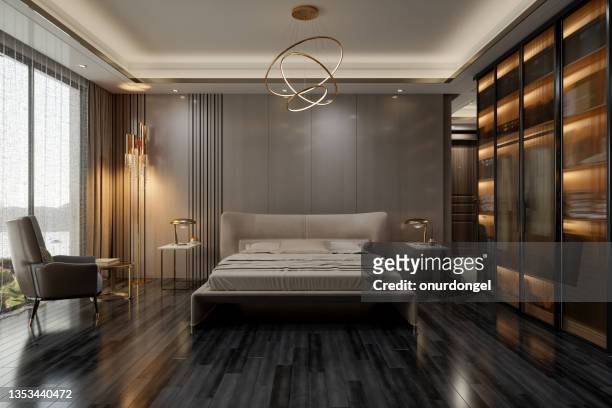 elegante interior de dormitorio con cama doble, mesitas de noche, sillón y vistas al mar a través de la ventana - luxury hotel fotografías e imágenes de stock