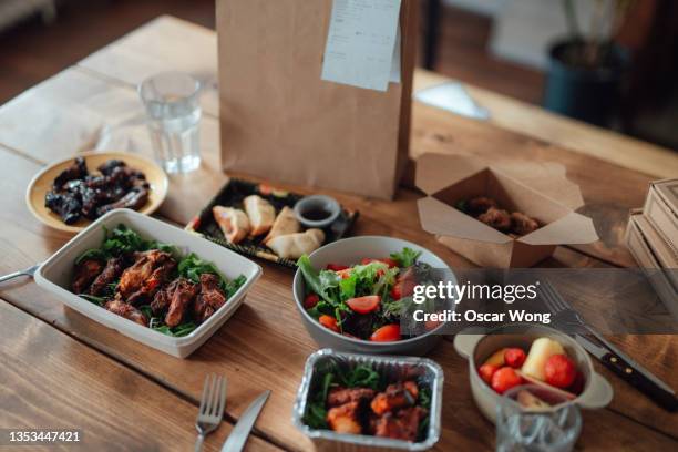 variation of takeaway meal on the table - take out food stock-fotos und bilder