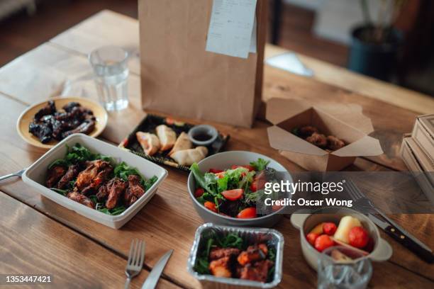 variation of takeaway meal on the table - chinese takeout stock pictures, royalty-free photos & images