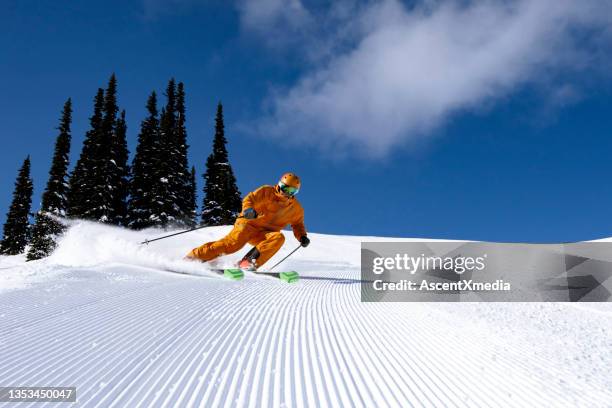 skier on groomed runs - ski slope imagens e fotografias de stock