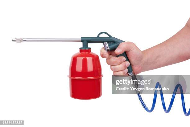 gravity flow cup in hand isolated on white background - compresor de aire fotografías e imágenes de stock