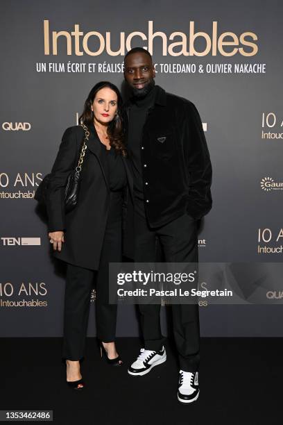 Omar Sy and Helene Sy attend the 10th Anniversary of the film "Intouchables" at UGC Normandie on November 15, 2021 in Paris, France.