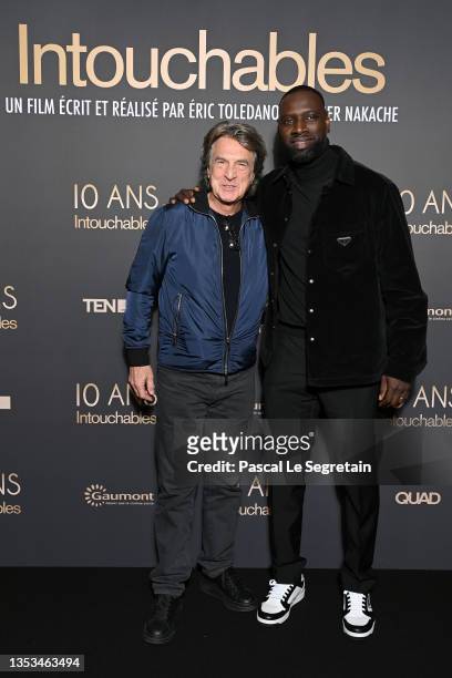François Cluzet and Omar Sy attend the 10th Anniversary of the film "Intouchables" at UGC Normandie on November 15, 2021 in Paris, France.