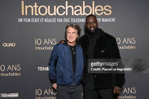 François Cluzet and Omar Sy attend the 10th Anniversary of the film "Intouchables" at UGC Normandie on November 15, 2021 in Paris, France.