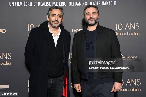 Eric Toledano and Olivier Nakache attend the 10th Anniversary of the film "Intouchables" at UGC Normandie on November 15, 2021 in Paris, France.