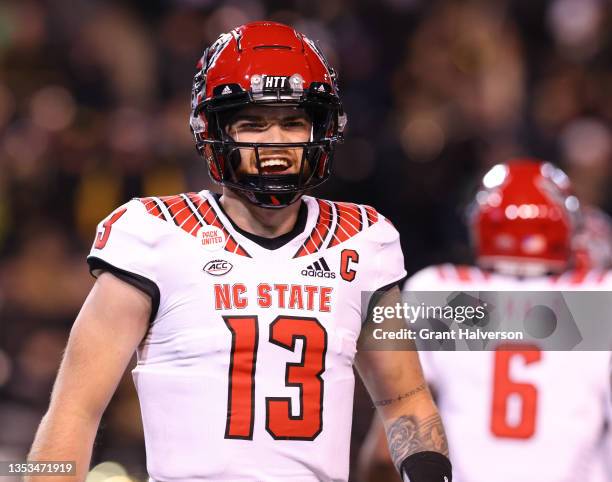 Devin Leary of the North Carolina State Wolfpack in action against the Wake Forest Demon Deacons during their game at Truist Field on November 13,...