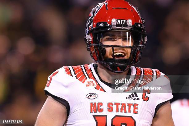 Devin Leary of the North Carolina State Wolfpack in action against the Wake Forest Demon Deacons during their game at Truist Field on November 13,...