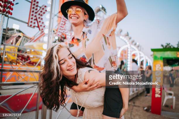 friends having fun at fair - fair stockfoto's en -beelden