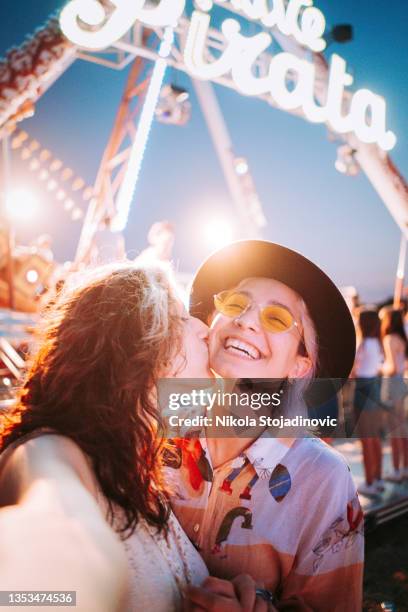 couple taking selfies at a fair - festival selfie stock pictures, royalty-free photos & images