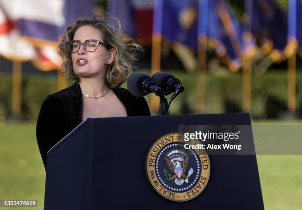 Sen. Kyrsten Sinema delivers remarks before President Joe Biden signed the Infrastructure Investment and Jobs Act during a ceremony on the South Lawn...