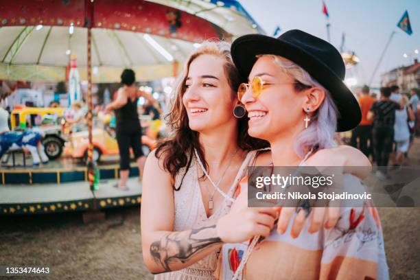 smiling women in target shooting tent - audience targeting stock pictures, royalty-free photos & images