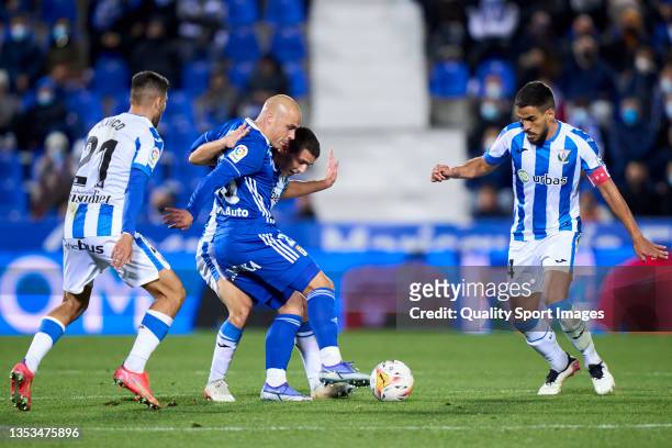 Sergi Palencia of CD Leganes battle for the ball with Jorge Pombo of Real Oviedo during the LaLiga Smartbank match between CD Leganes and Real...