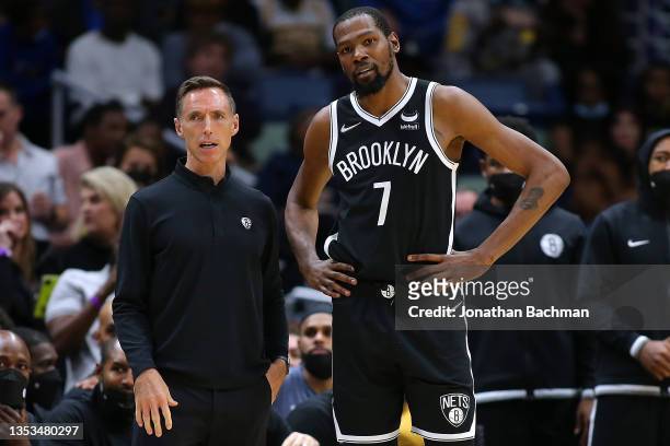 Kevin Durant of the Brooklyn Nets and head coach Steve Nash talk during a game against the New Orleans Pelicans at the Smoothie King Center on...