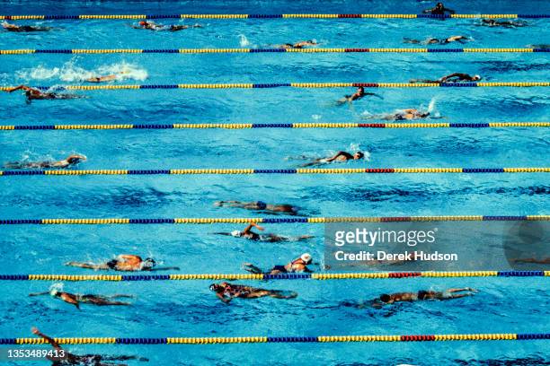 General view of competitors as they swim in a pool during a practice session at the 1992 Summer Olympics, Barcelona, Spain, between July and August...