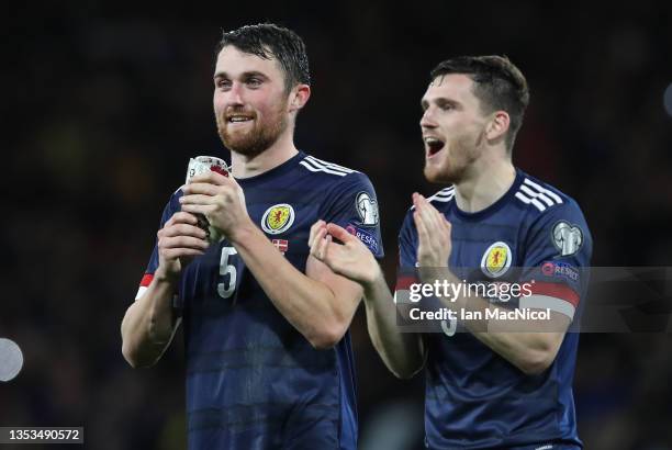 John Souttar and Andy Robertson of Scotland are seen at full time during the 2022 FIFA World Cup Qualifier match between Scotland and Denmark at...