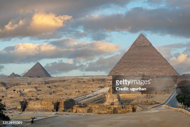 sphinx and pyramids in the giza necropolis. - pyramid of chephren stock pictures, royalty-free photos & images