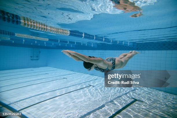 swimming in pool - swimming stroke stock pictures, royalty-free photos & images