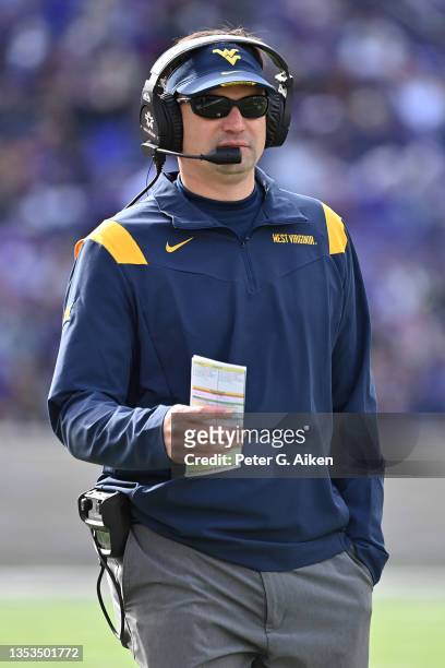 Head coach Neal Brown of the West Virginia Mountaineers looks out onto the field during the first half against the Kansas State Wildcats at Bill...