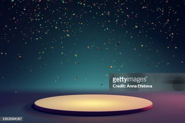round yellow ceramic podium on blue background with many falling multicolored confetti. perfect platform for showing your products. three dimensional illustration - sports round stock pictures, royalty-free photos & images