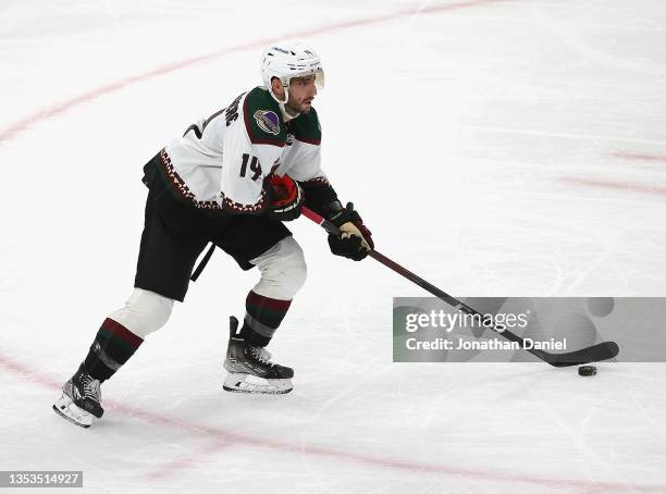 Shayne Gostisbehere of the Arizona Coyotes advances the puck against the Chicago Blackhawks at the United Center on November 12, 2021 in Chicago,...