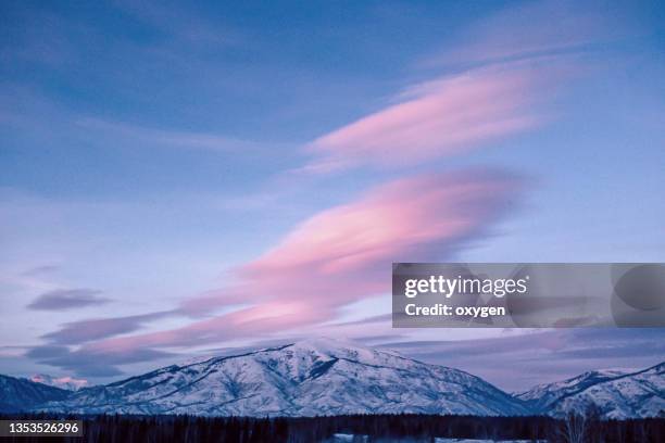 sunset clouds on winter. abstract beautiful sky in pink, violet. altai mountains of siberia landscape, russia - arctic stock pictures, royalty-free photos & images