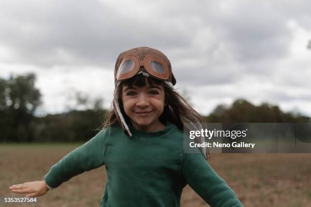 cute girl with an aviator cap - aviation hat 個照片及圖片檔
