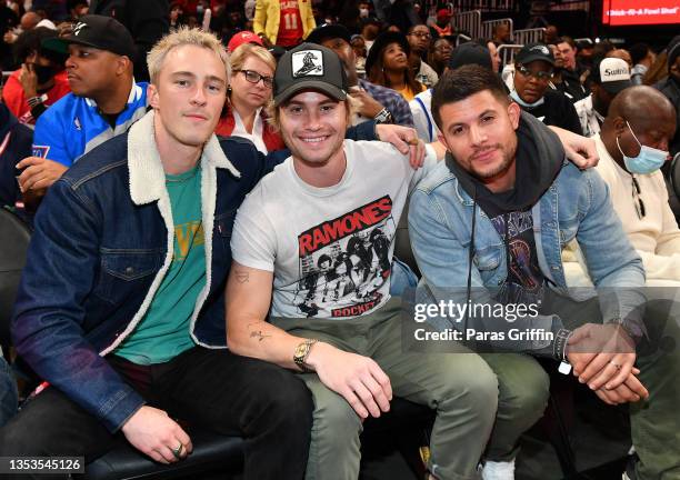 Drew Starkey, Chase Stokes and Nick Barrotta attend Orlando Magic v Atlanta Hawks game at State Farm Arena on November 15, 2021 in Atlanta, Georgia.