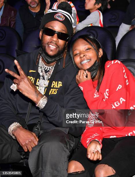 Rapper 2 Chainz and his daughter Heaven Epps attend Orlando Magic v Atlanta Hawks game at State Farm Arena on November 15, 2021 in Atlanta, Georgia.