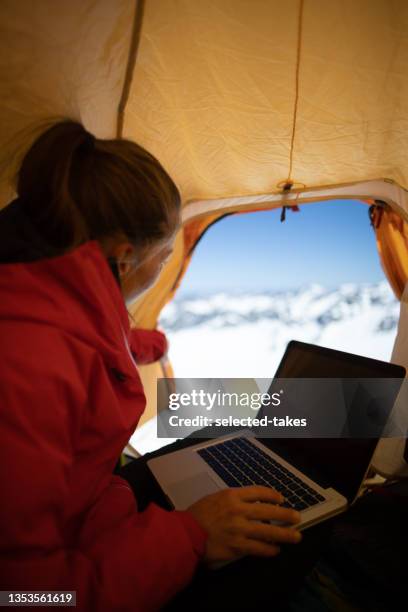 mountain climber using laptop - laptop high up stock pictures, royalty-free photos & images