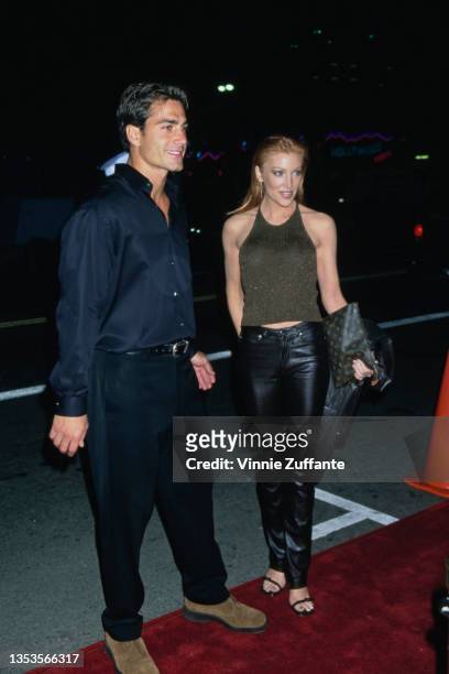American actor and model Michael Bergin and American actress Angelica Bridges attend the Westwood premiere of 'Pleasantville', held at the Mann...
