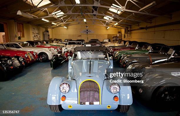 Morgan Motor Company Ltd. Roadster Sport automobile, centre, sits alongside an an Aero SuperSports automobile, right, and other completed vehicles...