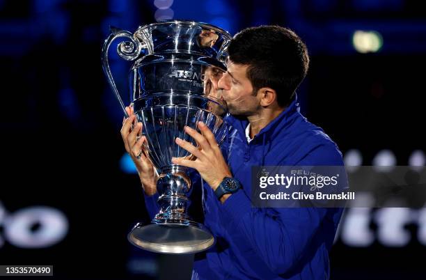 Novak Djokovic of Serbia kisses the world number 1 trophy for his 7th consecutive year during Day Two of the Nitto ATP World Tour Finals at Pala...