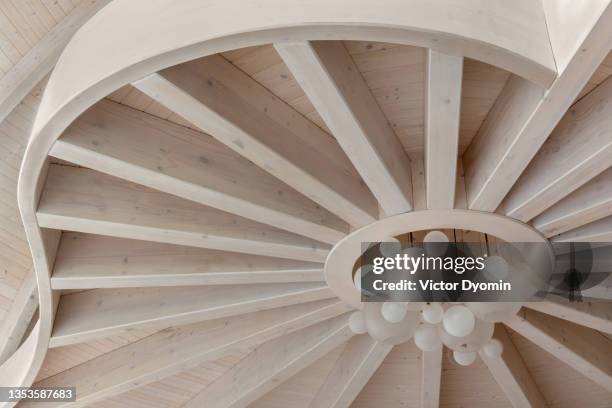 amazing wooden ceiling with stylish chandelier in the middle - 建築上の特徴 ストックフォトと画像