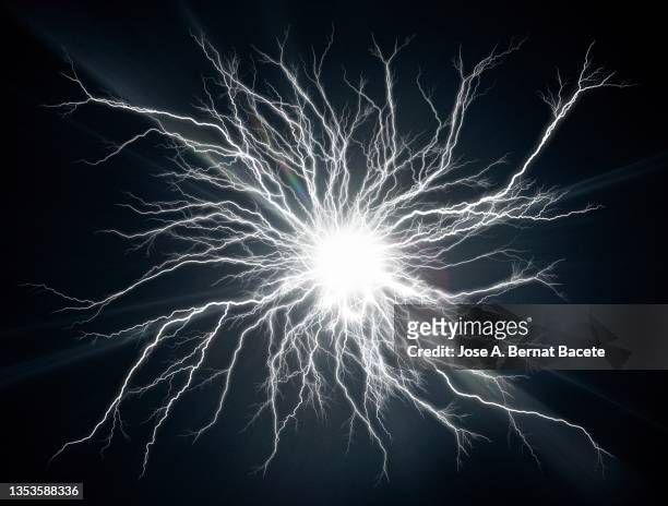 energy, electrical explosion with lightning on a black background. - flash stockfoto's en -beelden