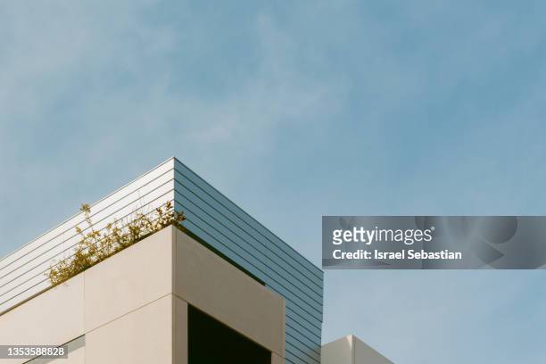 view of modern urban apartment buildings with a cloudy sky on background. - town square america stock pictures, royalty-free photos & images