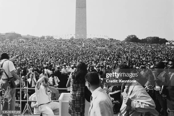 American folk singer and musician Joan Baez performs onstage for the 200,000 people gathered around the Lincoln Memorial during the March on...