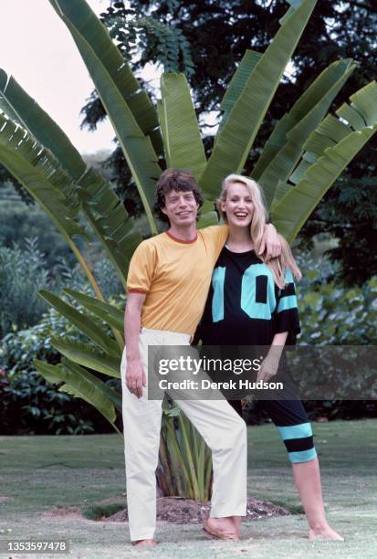 Portrait of couple, English Rock musician Mick Jagger and American model Jerry Hall, as they pose together during a vacation on the island of...