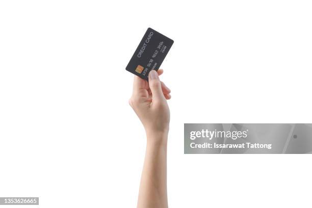 hand holding credit card isolated on white - human hand stock pictures, royalty-free photos & images