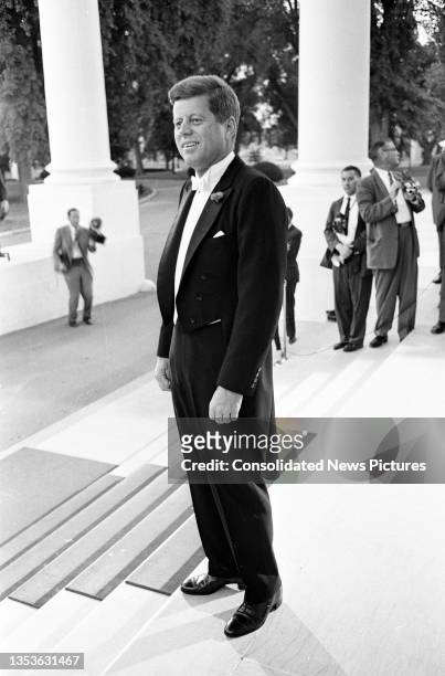 View of US President John F Kennedy as he stands on the White House's North Portico prior to a State Dinner , Washington DC, May 22, 1962.