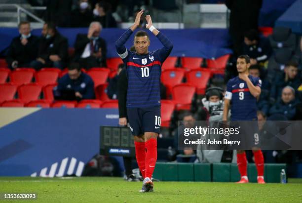 Kylian Mbappe of France applauds the supporters when he's replaced by Wissam Ben Yedder during the 2022 FIFA World Cup Qualifier match between France...