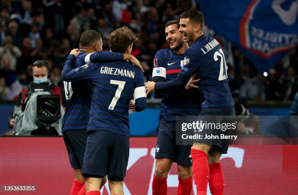 Kylian Mbappe of France celebrates his first goal with Antoine Griezmann, Theo Hernandez, Lucas Hernandez during the 2022 FIFA World Cup Qualifier...