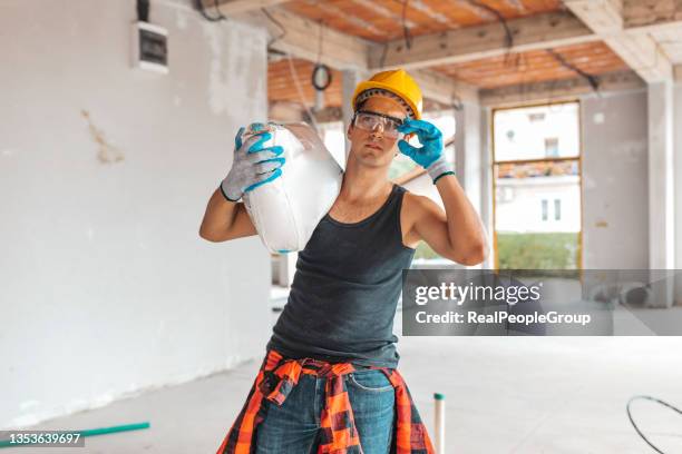 construction worker on building site - zement stock pictures, royalty-free photos & images