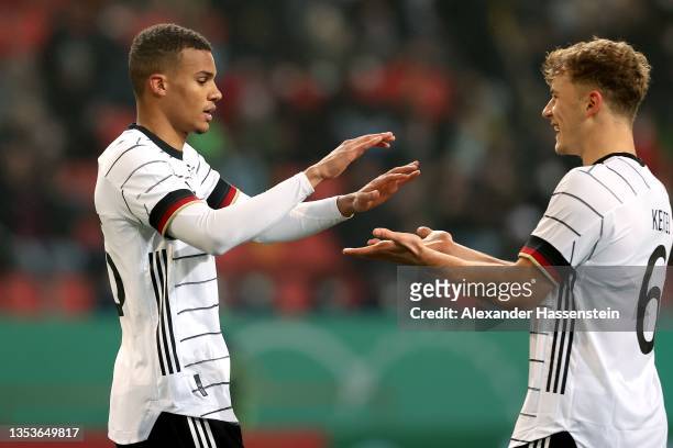 Malick Thiaw of Germany celebrates scoring the opening goal with team mate Yannik Keitel during the 2022 UEFA European Under-21 Championship...